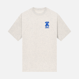 NOOB Spanky Logo embroidered in blue on the font of a heather oatmeal t-shirt.