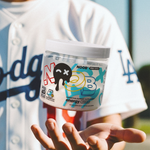 Person holding a container of NOOB energy supplement in front of a blurred background